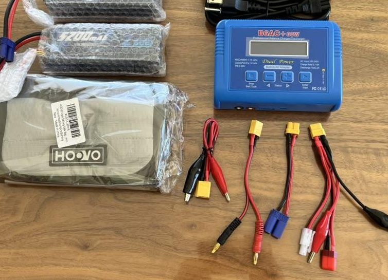 Robot batteries, a battery charger, and charging cables